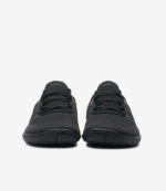 Sorte Xero Nexus Knit Herre barfodssko med meshoverdel, snørebånd og bred tåboks i minimalistisk design på hvid baggrund.