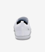 Hvid Xero Nexus Knit barfodssko til mænd, set bagfra med trækflig i hælen, minimal slidbane, bred tåboks og branding på siden.