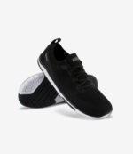 Sort og hvid Xero Nexus Knit barfodssko til kvinder, bred tåboks, minimalistiske sneakers med synlig slidbane og logoer.