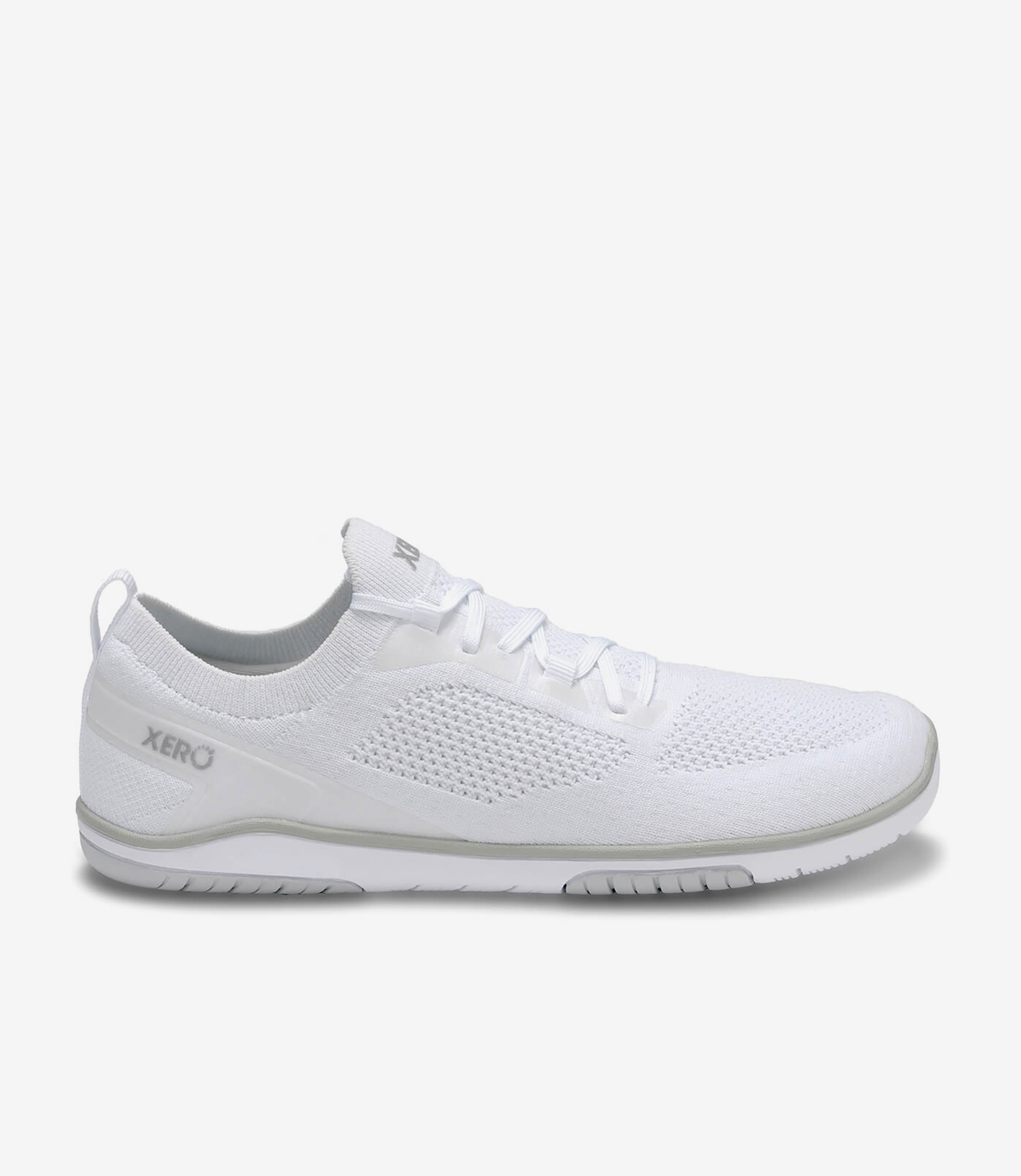 Hvide Xero Nexus Knit barfodssko til kvinder med overdel i mesh, bred tåboks, fleksibel sål og minimalistisk sneaker-design.