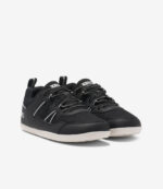 Sorte og hvide Xero Prio børn barfodssneakers med overdel i mesh, bred tåboks, minimalistisk sål, til børn på hvid baggrund.