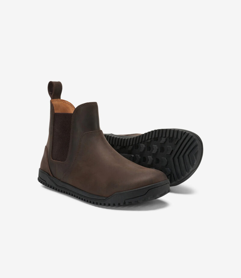 Brune Xero Ridgeway Chelsea barfodsstøvler i læder med bred tå, sorte såler; udsigt til siden og sålen for minimalistisk stil.