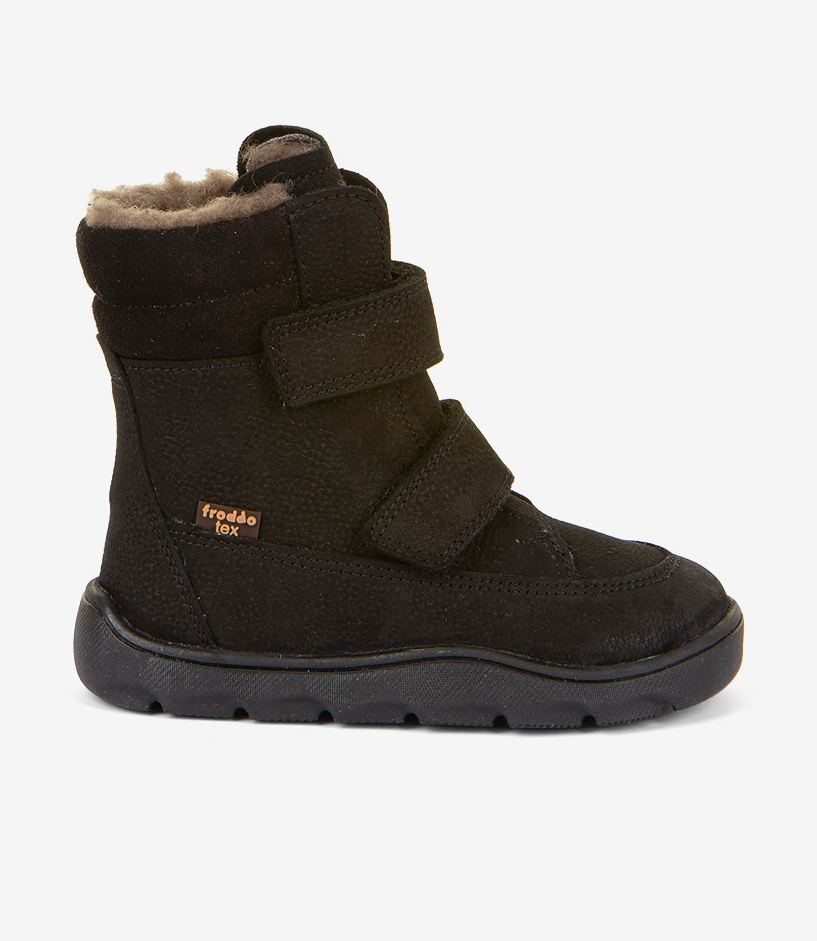 Sort barfodet børnesko i ruskind med loddent for, bred tåzone, velcroremme og fleksibel gummisål på hvid baggrund.